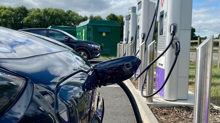 Electric car plugged in a rapid charge point