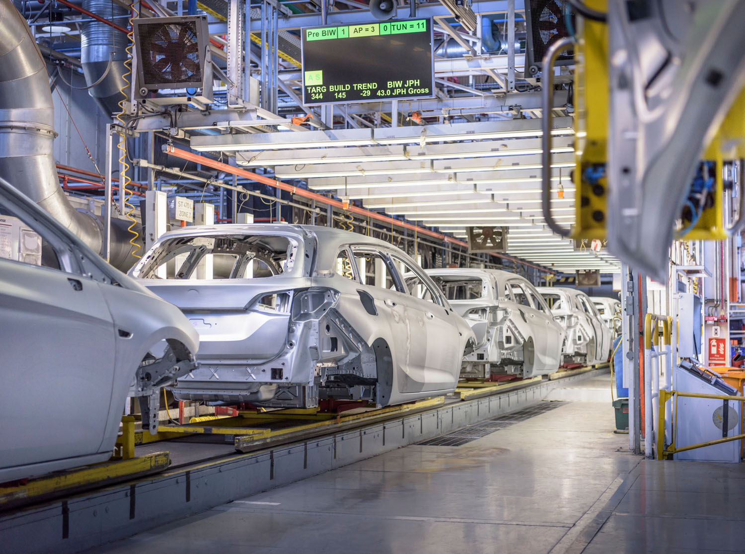 View of cars on production line in factory